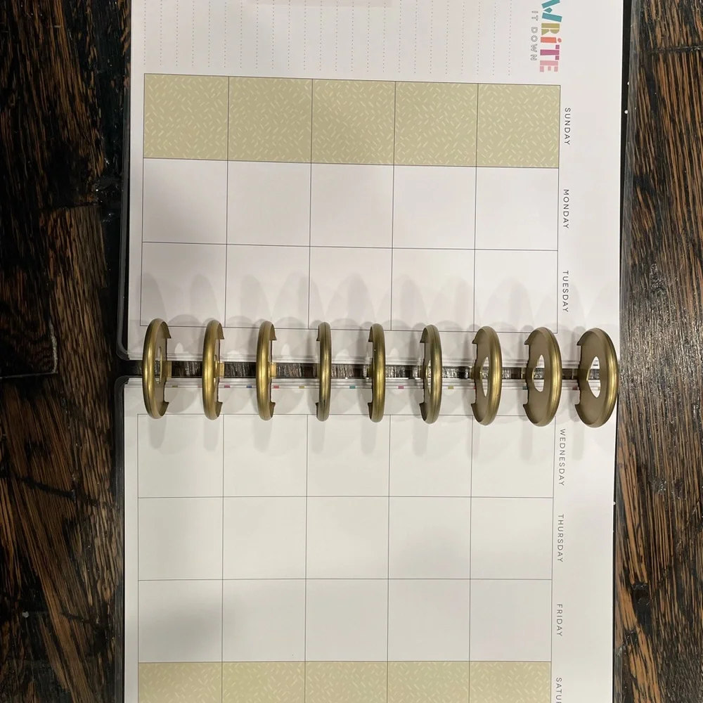The Happy Planner Colorful Wave Calendar -mix of pages, rings, monthly dividers.